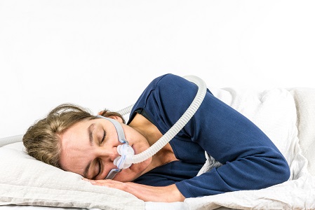 sleep apnea treatment with CPAP therapy woman, sleeping